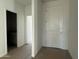 Inviting entryway featuring a solid white door and neutral tones, creating a bright and welcoming atmosphere at 9531 W Parkway Dr, Tolleson, AZ 85353