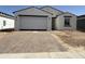 Charming single-Gathering home with a two-car garage and a neatly paved driveway, enhancing curb appeal at 9531 W Parkway Dr, Tolleson, AZ 85353