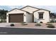 Charming single-story home with a two-car garage and desert landscaping at 9531 W Parkway Dr, Tolleson, AZ 85353