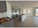 Open-concept kitchen with gray cabinets, creating a modern and inviting space for cooking and entertaining at 9531 W Parkway Dr, Tolleson, AZ 85353