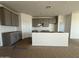 Well-lit kitchen featuring stylish gray cabinets, perfect for creating a culinary masterpiece at 9531 W Parkway Dr, Tolleson, AZ 85353