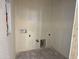 New laundry room with unfinished walls and utility connections, ready for custom design at 9531 W Parkway Dr, Tolleson, AZ 85353