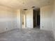 Spacious living room with bare walls ready to customize to your liking at 9531 W Parkway Dr, Tolleson, AZ 85353