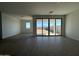 Large living area with lots of natural light and sliding glass door access at 9531 W Parkway Dr, Tolleson, AZ 85353