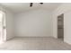 Neutral bedroom features plush carpeting, a sliding glass door to the balcony, and a large closet at 9649 S 51 St St, Phoenix, AZ 85044
