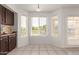 Bright breakfast nook boasts a large bay window with views of the neighborhood at 9649 S 51 St St, Phoenix, AZ 85044