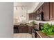 Well-equipped kitchen with dark cabinetry and stainless steel appliances at 9649 S 51 St St, Phoenix, AZ 85044