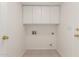 Clean laundry room featuring upper cabinets and utility hookups at 9649 S 51 St St, Phoenix, AZ 85044