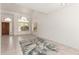 Bright, open room with tile floors, neutral walls, vaulted ceiling, and natural light at 9649 S 51 St St, Phoenix, AZ 85044