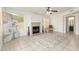 Spacious living room with fireplace, tile flooring, and large windows at 9649 S 51 St St, Phoenix, AZ 85044