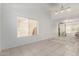 Bright, open living room with tile floors, neutral walls, and modern lighting at 9649 S 51 St St, Phoenix, AZ 85044