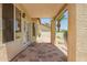 Charming covered patio with stone flooring, perfect for outdoor relaxation and entertaining at 9649 S 51 St St, Phoenix, AZ 85044