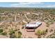 Aerial view of a desert home with a custom patio surrounded by desert landscaping at 10600 E Cordova St, Gold Canyon, AZ 85118