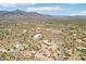 Sweeping aerial shot of desert community with stunning mountain backdrop at 10600 E Cordova St, Gold Canyon, AZ 85118