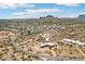 Aerial view of a desert community featuring spacious home with mountain views and serene surroundings at 10600 E Cordova St, Gold Canyon, AZ 85118