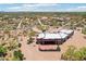 Aerial view of a Southwestern-style home with large red patio and desert landscaping at 10600 E Cordova St, Gold Canyon, AZ 85118