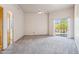 Spacious bedroom features sliding glass doors with desert views and a ceiling fan at 10600 E Cordova St, Gold Canyon, AZ 85118