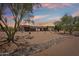 Stunning desert home featuring a spacious layout, three-car garage, neutral colors, and beautiful desert landscaping at 10600 E Cordova St, Gold Canyon, AZ 85118