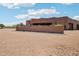 Exterior of the home featuring desert landscaping, combining architectural design with natural surroundings, providing a peaceful retreat at 10600 E Cordova St, Gold Canyon, AZ 85118