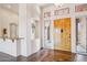 Welcoming foyer with tile flooring, a bar, and an art niche, leading into the home's interior at 10600 E Cordova St, Gold Canyon, AZ 85118