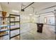 Large garage with high ceilings, multiple doors, built in shelves, and room for parking at 10600 E Cordova St, Gold Canyon, AZ 85118