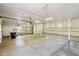 Spacious garage with built-in shelving and ample room for multiple vehicles and storage, offering organization and convenience at 10600 E Cordova St, Gold Canyon, AZ 85118