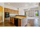 Well-equipped kitchen featuring granite countertops and stainless steel appliances with views to the living room at 10600 E Cordova St, Gold Canyon, AZ 85118