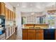 Well-equipped kitchen featuring granite countertops and stainless steel appliances with views to the living room at 10600 E Cordova St, Gold Canyon, AZ 85118