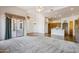 Open-concept living area with carpet, archways, tile floor, and access to the patio at 10600 E Cordova St, Gold Canyon, AZ 85118