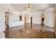Open-concept living area with tile flooring, high ceilings, arched doorways, and natural light at 10600 E Cordova St, Gold Canyon, AZ 85118