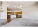 Open-concept living area with carpet, tile floor, oak cabinets, and plenty of natural light at 10600 E Cordova St, Gold Canyon, AZ 85118