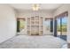 Spacious living area with carpet flooring, a built-in entertainment center, and desert views at 10600 E Cordova St, Gold Canyon, AZ 85118