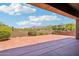 Covered patio features ample space for outdoor entertaining while enjoying mountain views, offering relaxation and recreation at 10600 E Cordova St, Gold Canyon, AZ 85118