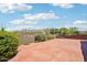 Spacious patio featuring beautiful landscaping, offering privacy and a serene outdoor space for relaxation and recreation at 10600 E Cordova St, Gold Canyon, AZ 85118