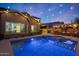 Beautiful backyard featuring a swimming pool, outdoor kitchen, and pergola-covered seating area at 10746 W Desert Elm Ln, Peoria, AZ 85383