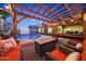 Inviting backyard with a pool, fire pit, pergola, and ample seating for relaxing and entertaining at 10746 W Desert Elm Ln, Peoria, AZ 85383