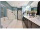 Bright bathroom boasts a soaking tub, walk-in shower, dual vanity, and modern fixtures at 10746 W Desert Elm Ln, Peoria, AZ 85383