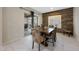 Dining room features a wood accent wall and sliding door to outdoor patio at 10746 W Desert Elm Ln, Peoria, AZ 85383