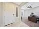 Inviting foyer with tile flooring and a view into a naturally lit office space at 10746 W Desert Elm Ln, Peoria, AZ 85383