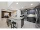 Modern kitchen boasts granite countertops, stainless steel appliances and breakfast bar at 10746 W Desert Elm Ln, Peoria, AZ 85383