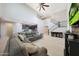 Spacious living room features modern staircase, neutral decor and tile flooring at 10746 W Desert Elm Ln, Peoria, AZ 85383
