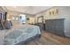 Comfortable bedroom with stylish furniture, wood flooring, and neutral paint for relaxation at 10746 W Desert Elm Ln, Peoria, AZ 85383