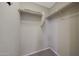 Walk-in closet with built in shelves and rod for hanging clothes at 10746 W Desert Elm Ln, Peoria, AZ 85383