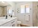 Bright bathroom featuring a modern vanity and shower with elegant tile work at 10839 W Peoria Ave, Sun City, AZ 85351