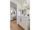Bathroom with a view of the vanity, mirror, and shower in a modern design at 10839 W Peoria Ave, Sun City, AZ 85351