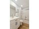 Clean bathroom with vanity, updated faucet, and framed mirror at 10839 W Peoria Ave, Sun City, AZ 85351
