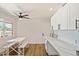 Bright dining area with a modern fan, and luxury vinyl plank flooring at 10839 W Peoria Ave, Sun City, AZ 85351