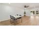 Dining area with modern lighting, complemented by luxury vinyl plank flooring at 10839 W Peoria Ave, Sun City, AZ 85351