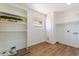 Clean laundry room featuring shelving, a window, and washer/dryer hookups at 10839 W Peoria Ave, Sun City, AZ 85351