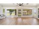 Inviting sunroom with lots of natural light and wood floors at 10839 W Peoria Ave, Sun City, AZ 85351
